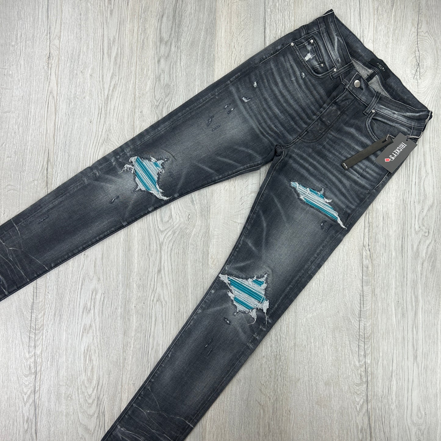 Amiri Men’s MX1 Black Distressed Jeans Blue Patch