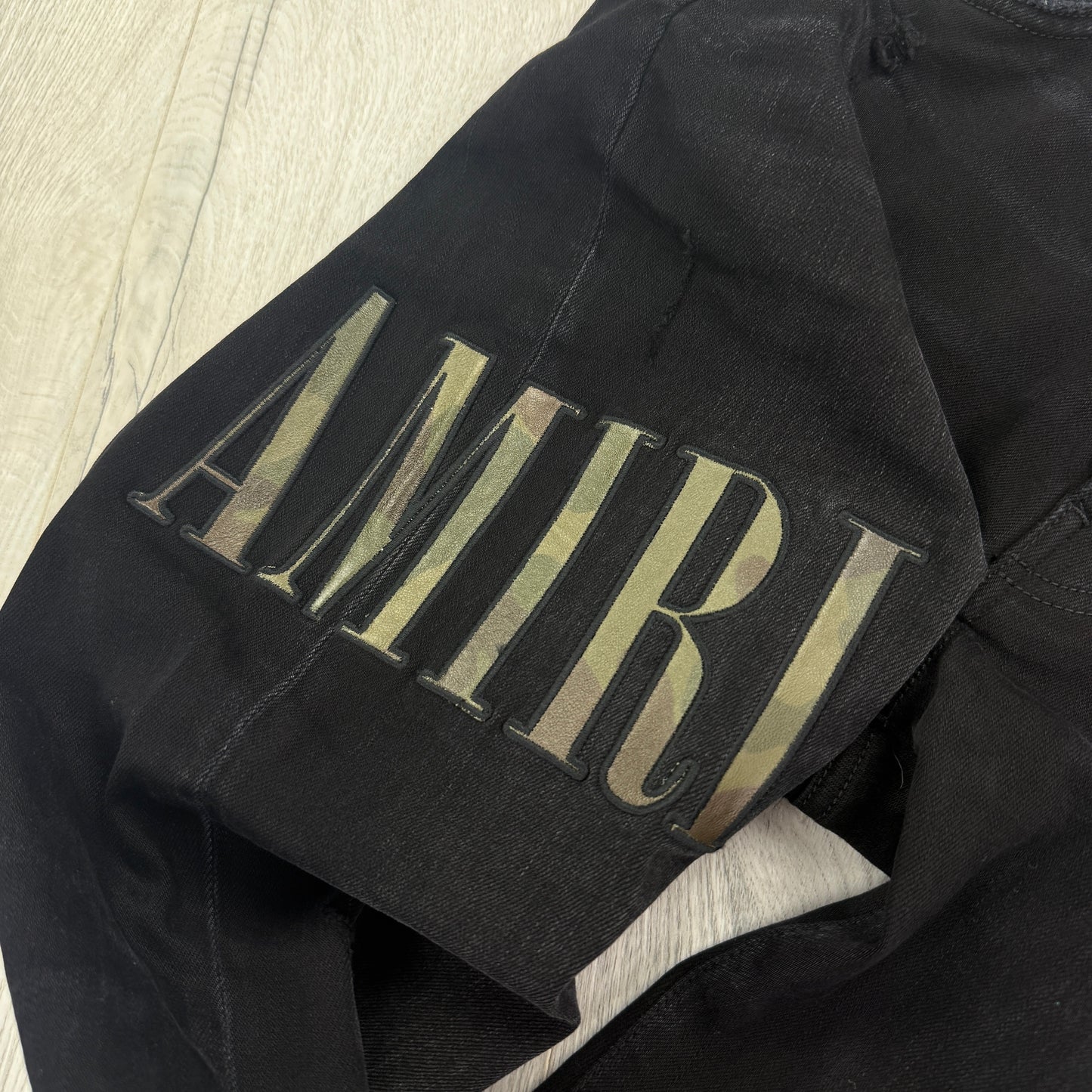Amiri MX1 Men’s Black Distressed Core Camouflage Applique Jeans