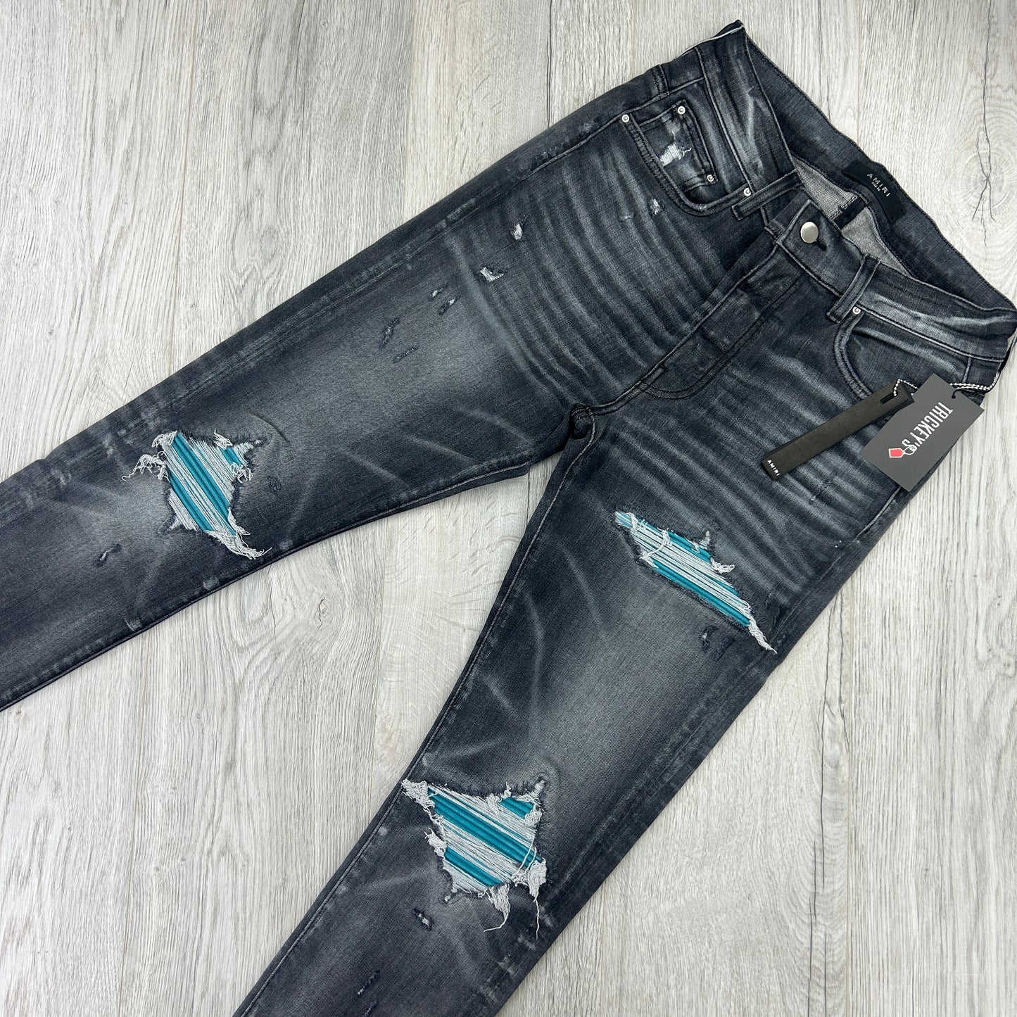 Amiri Men’s MX1 Black Distressed Jeans Blue Patch