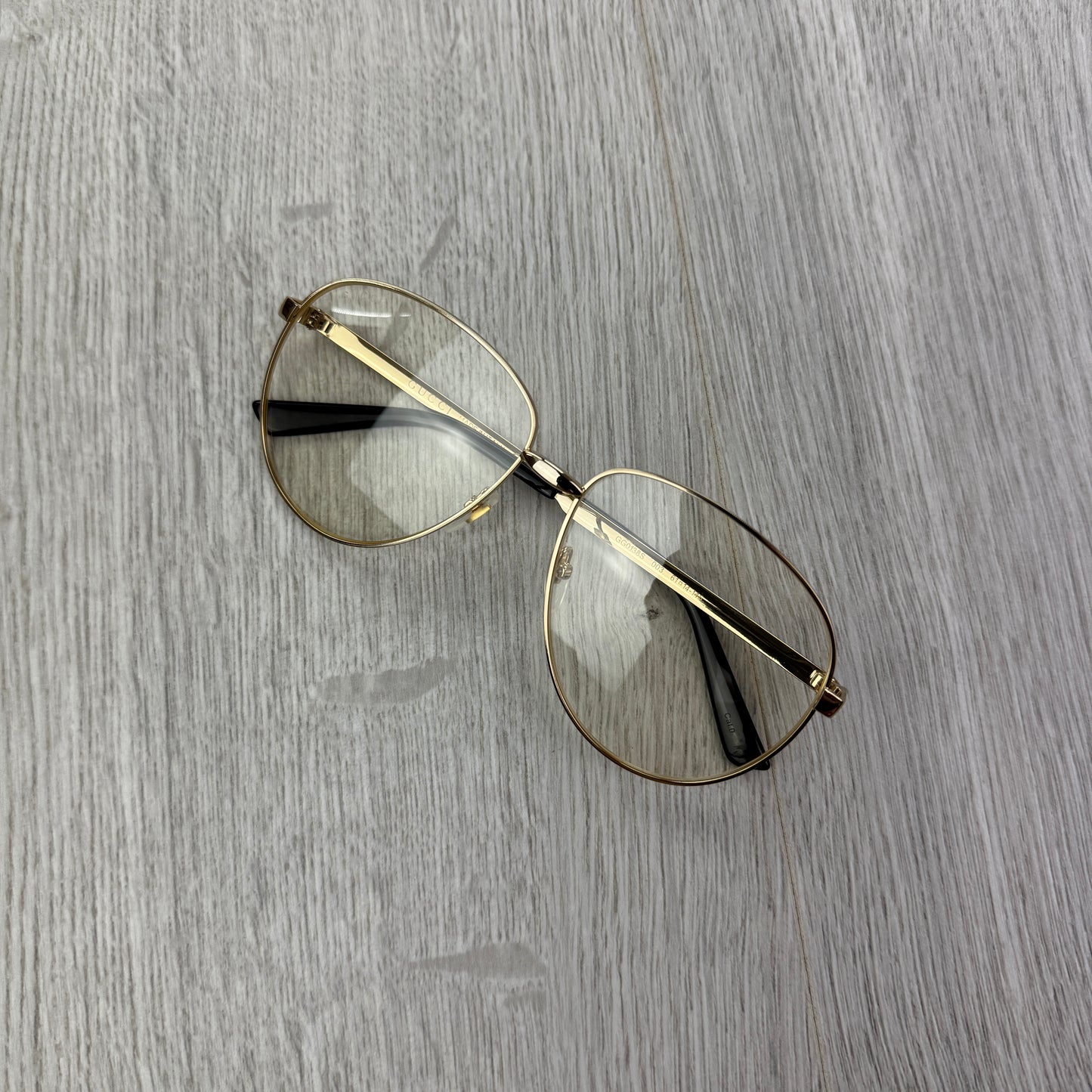 Gucci Men’s Gold Clear Frames