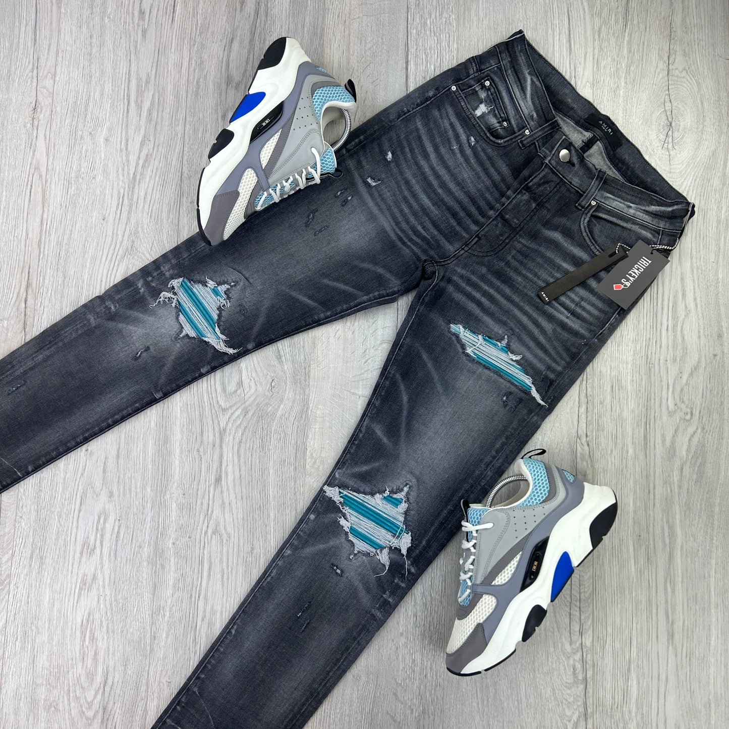 Amiri Men’s MX1 Black Distressed Jeans Blue Patch