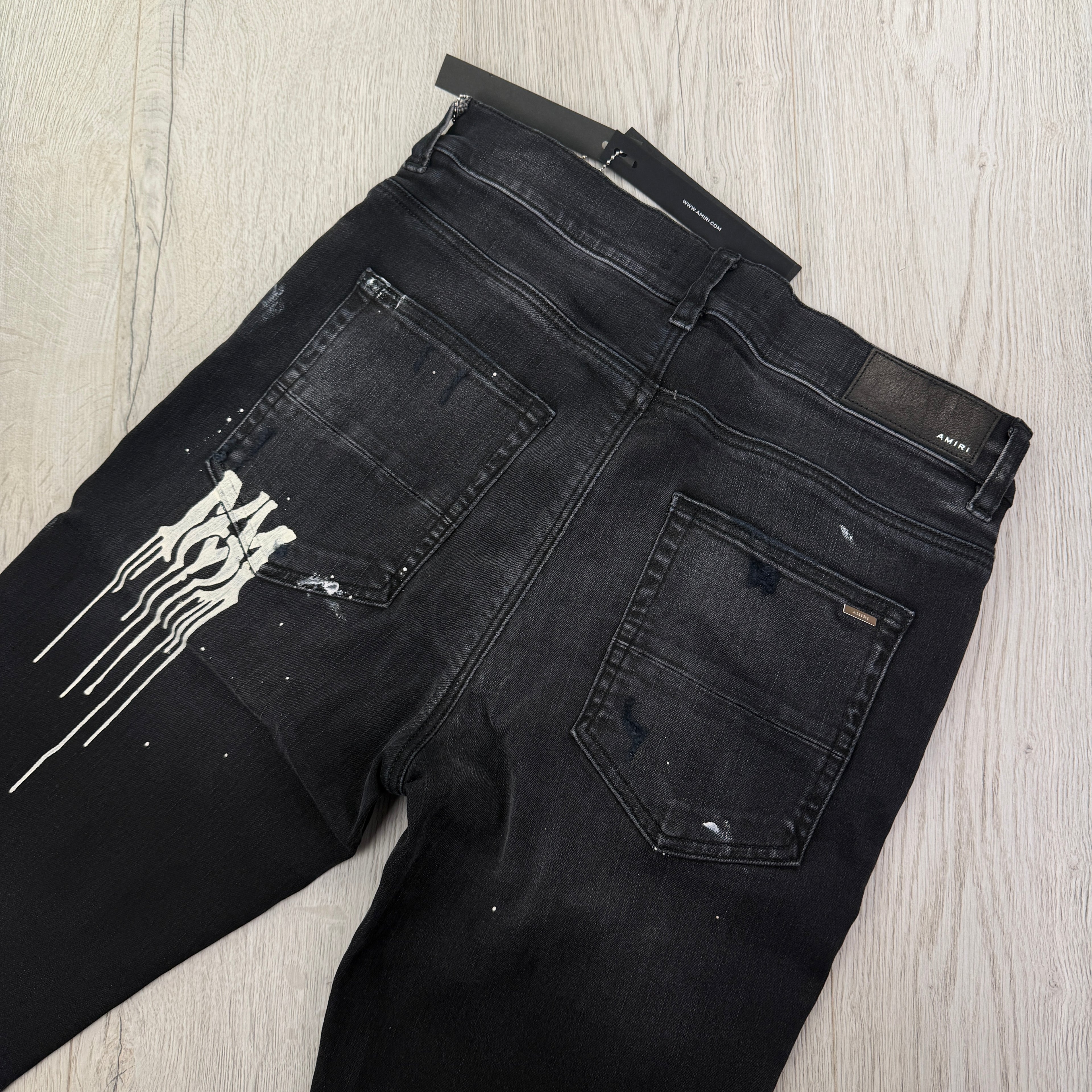 Amiri Men’s MX1 MA Logo Drip Black Distressed Jeans