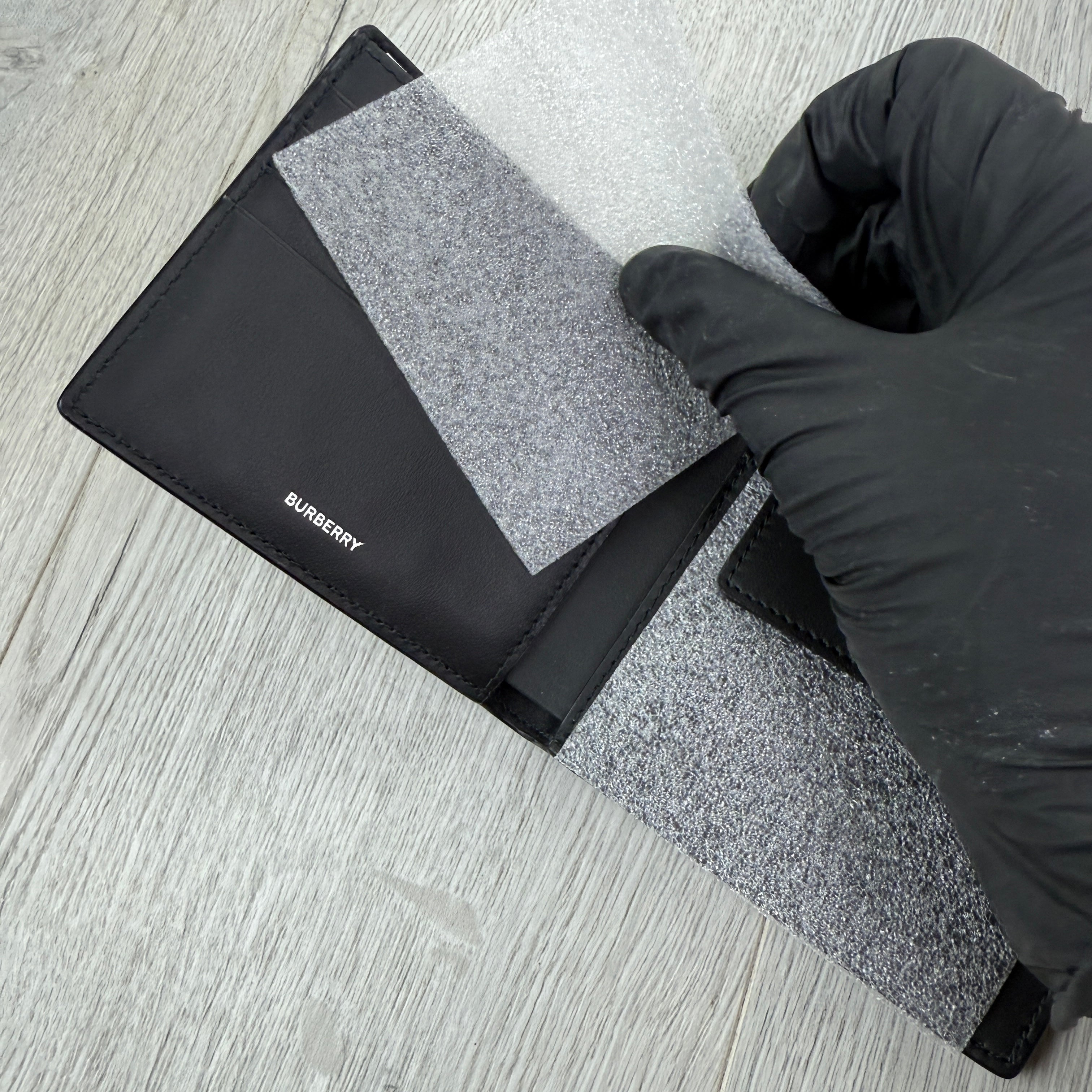 Burberry Men’s Black Leather Bifold Wallet Silver Logo