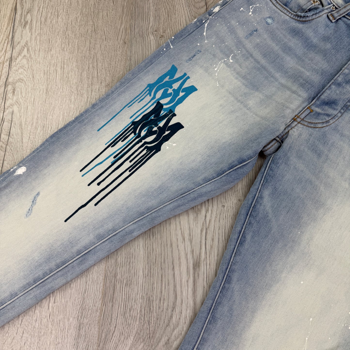 Amiri Men’s MX1 MA Logo Drip Blue Distressed Jeans