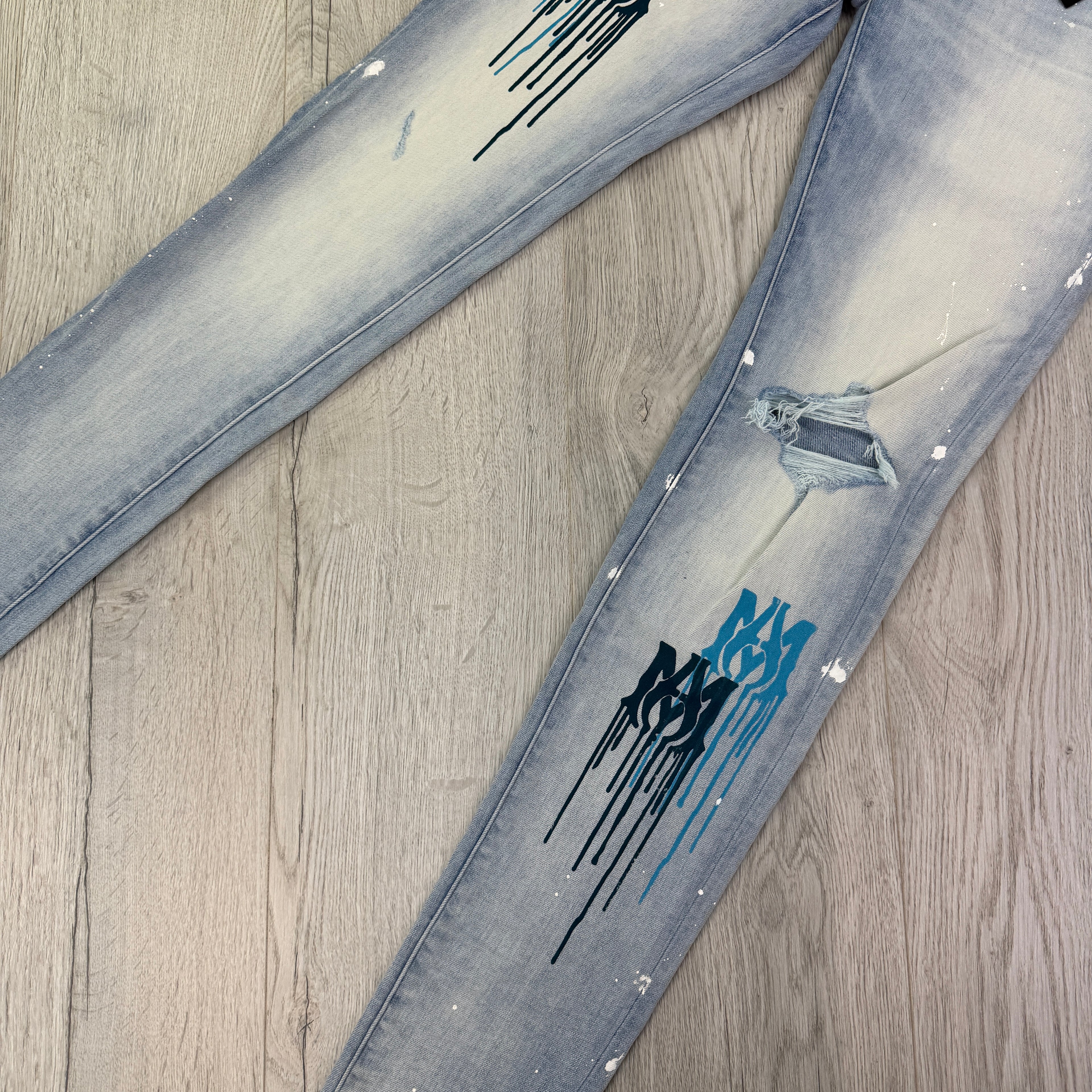 Amiri Men’s MX1 MA Logo Drip Blue Distressed Jeans