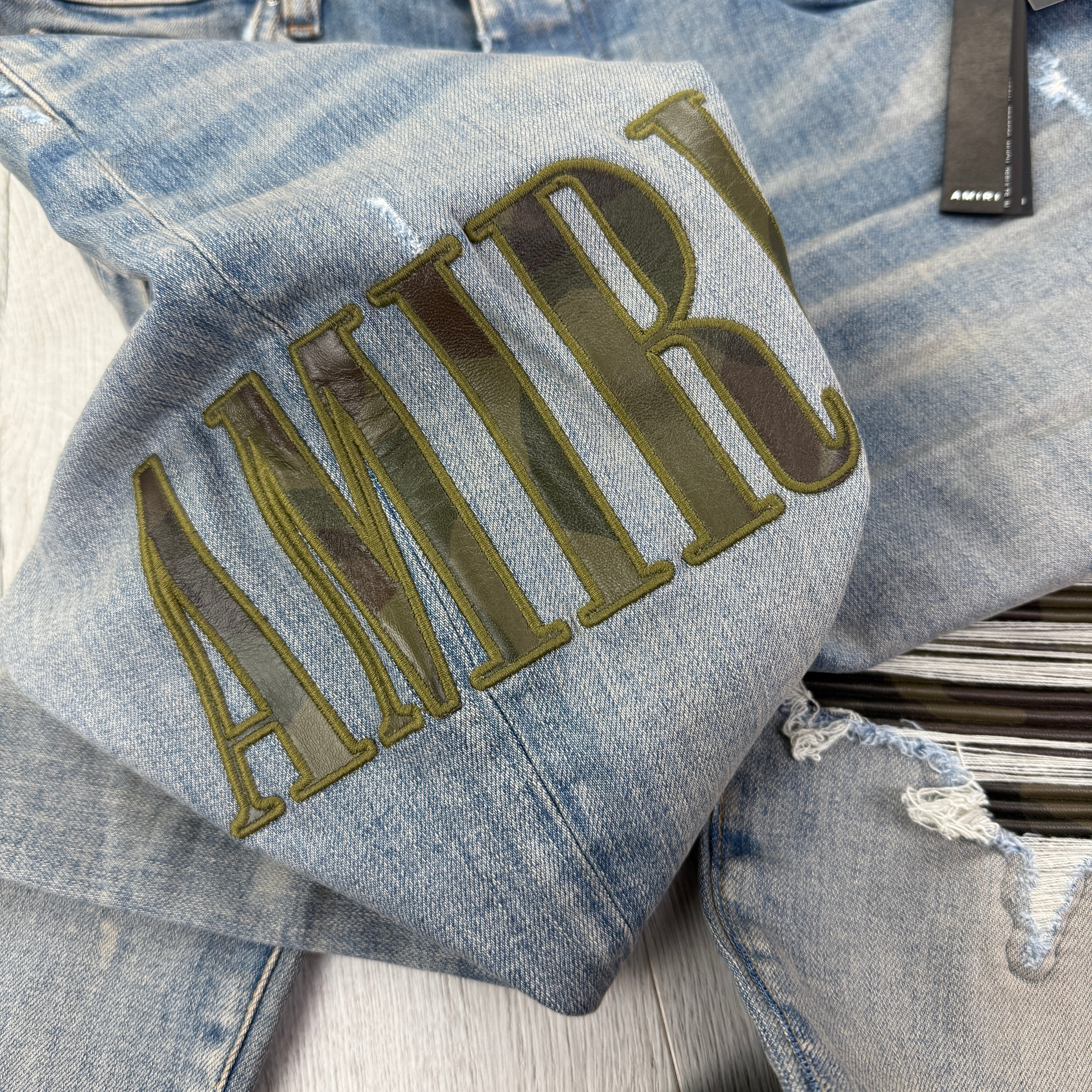 Amiri Men’s MX1 Distressed Camo Applique Logo Jeans