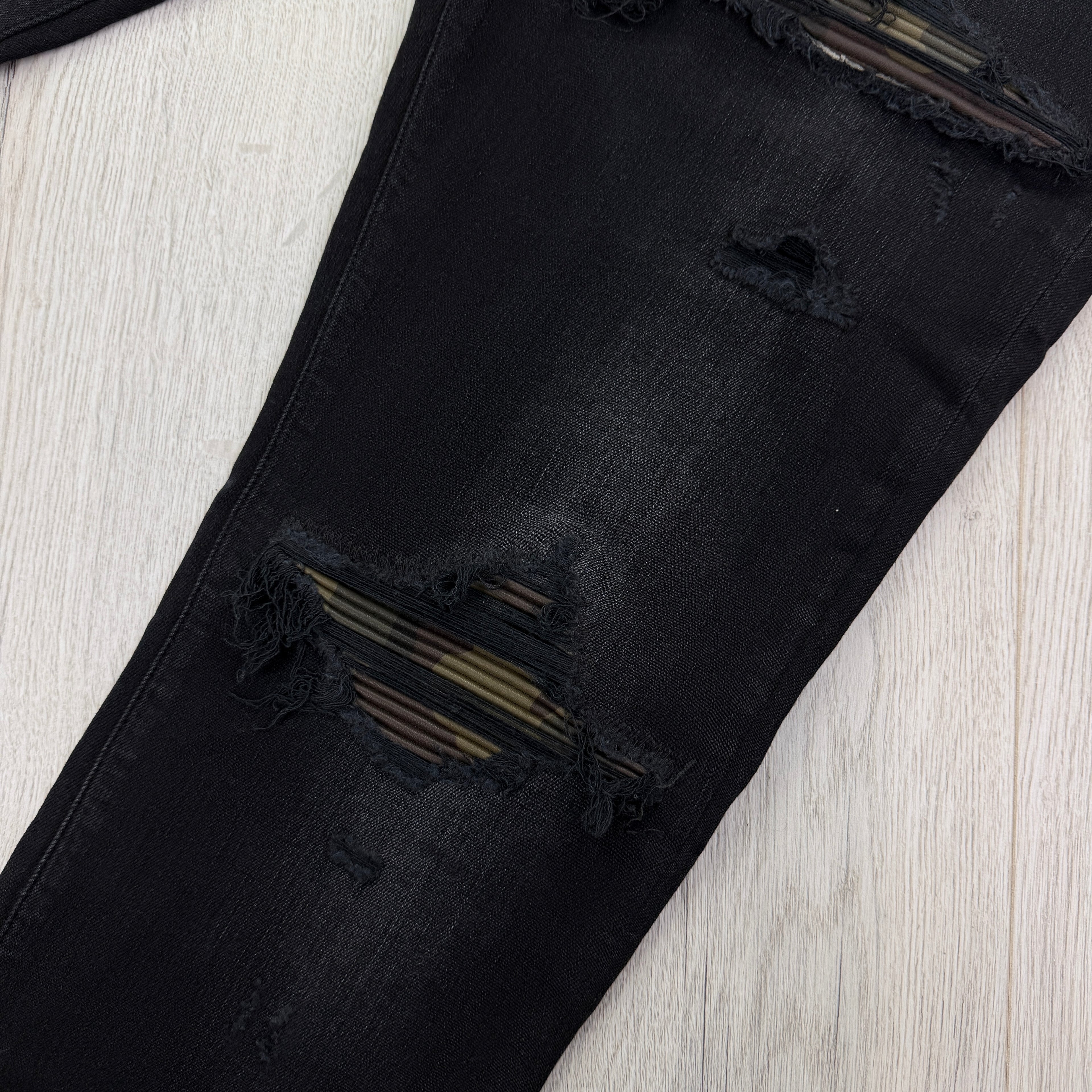 Amiri MX1 Men’s Black Distressed Core Camouflage Applique Jeans