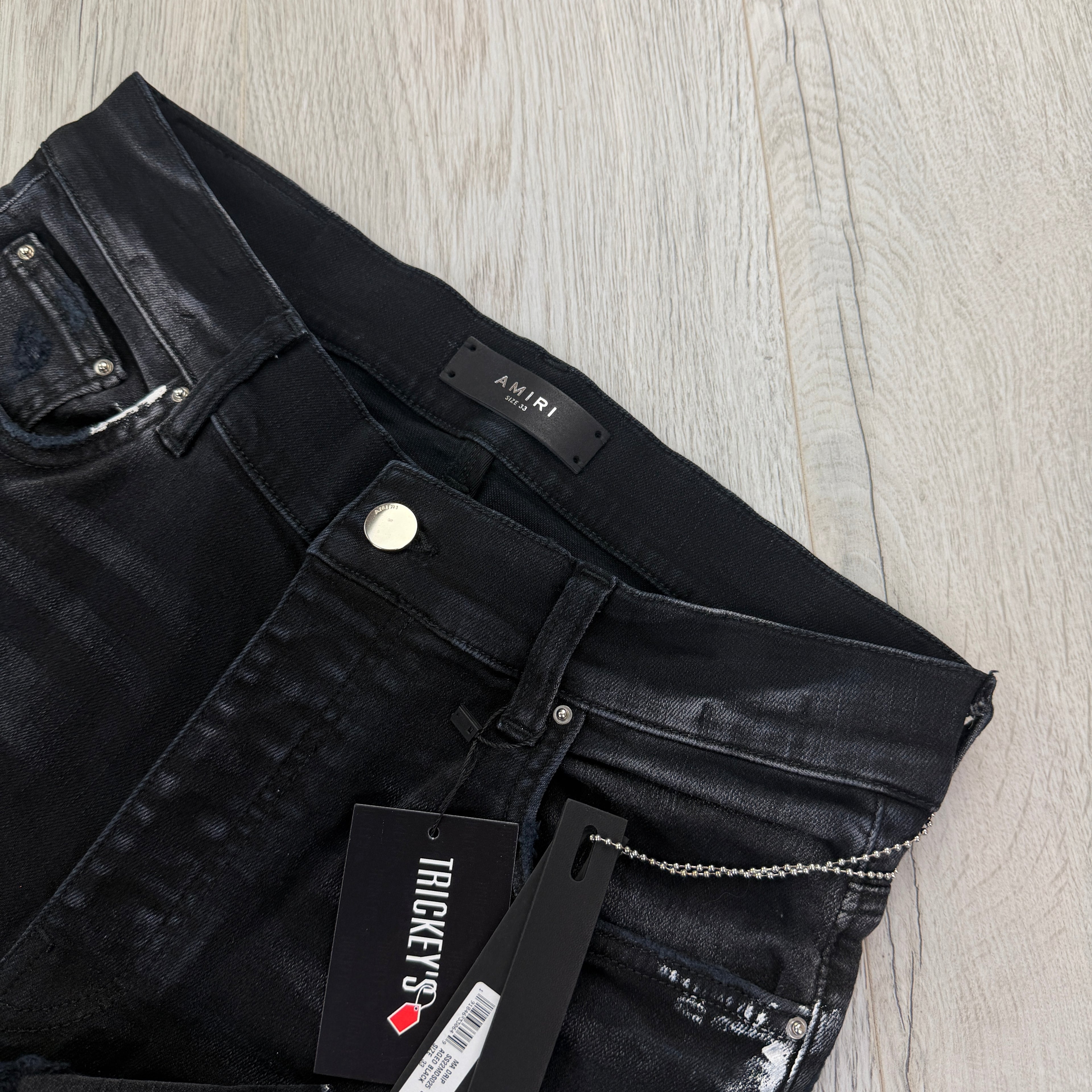 Amiri Men’s MX1 MA Logo Drip Black Distressed Jeans