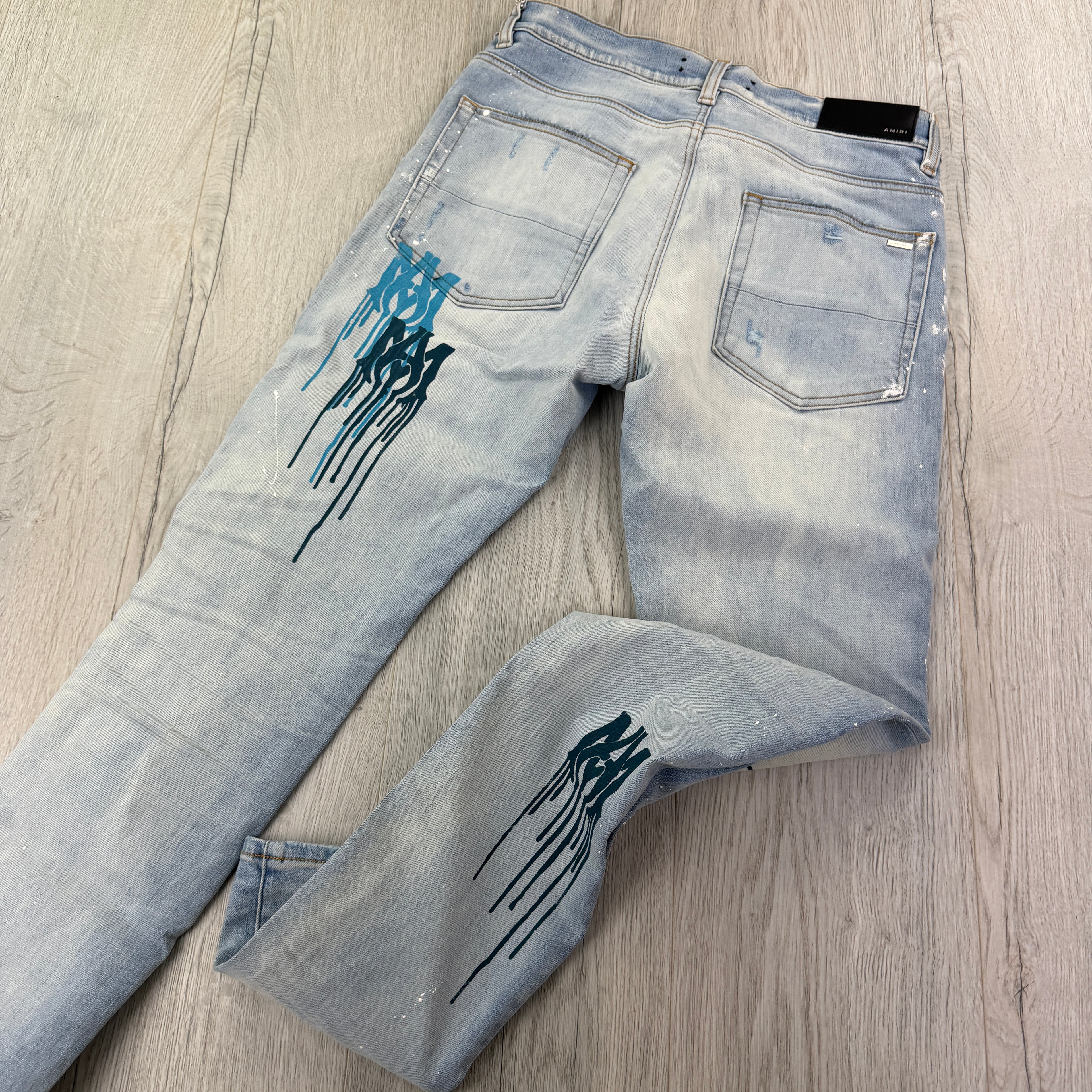 Amiri Men’s MX1 MA Logo Drip Blue Distressed Jeans