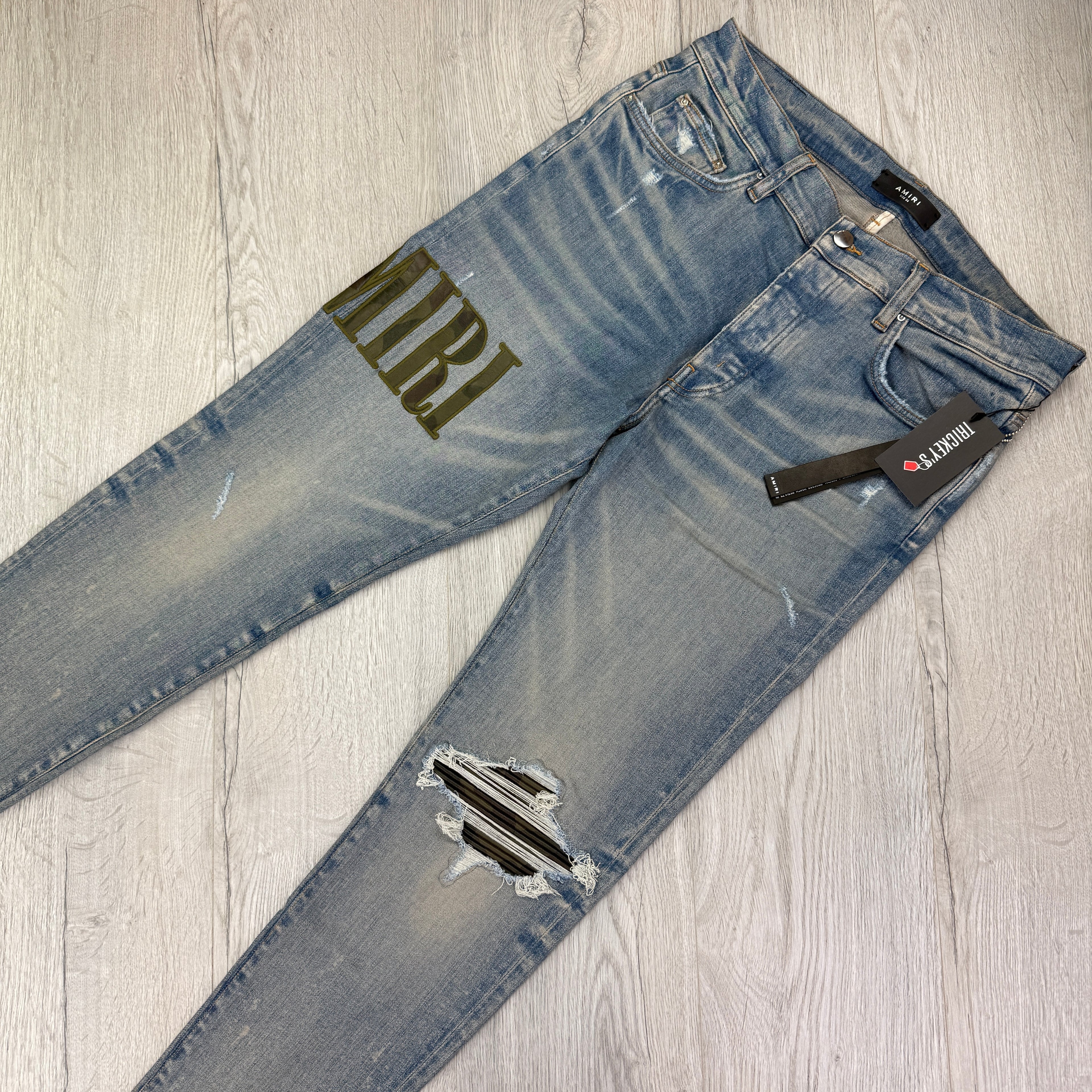 Amiri Men’s MX1 Distressed Camo Applique Logo Jeans