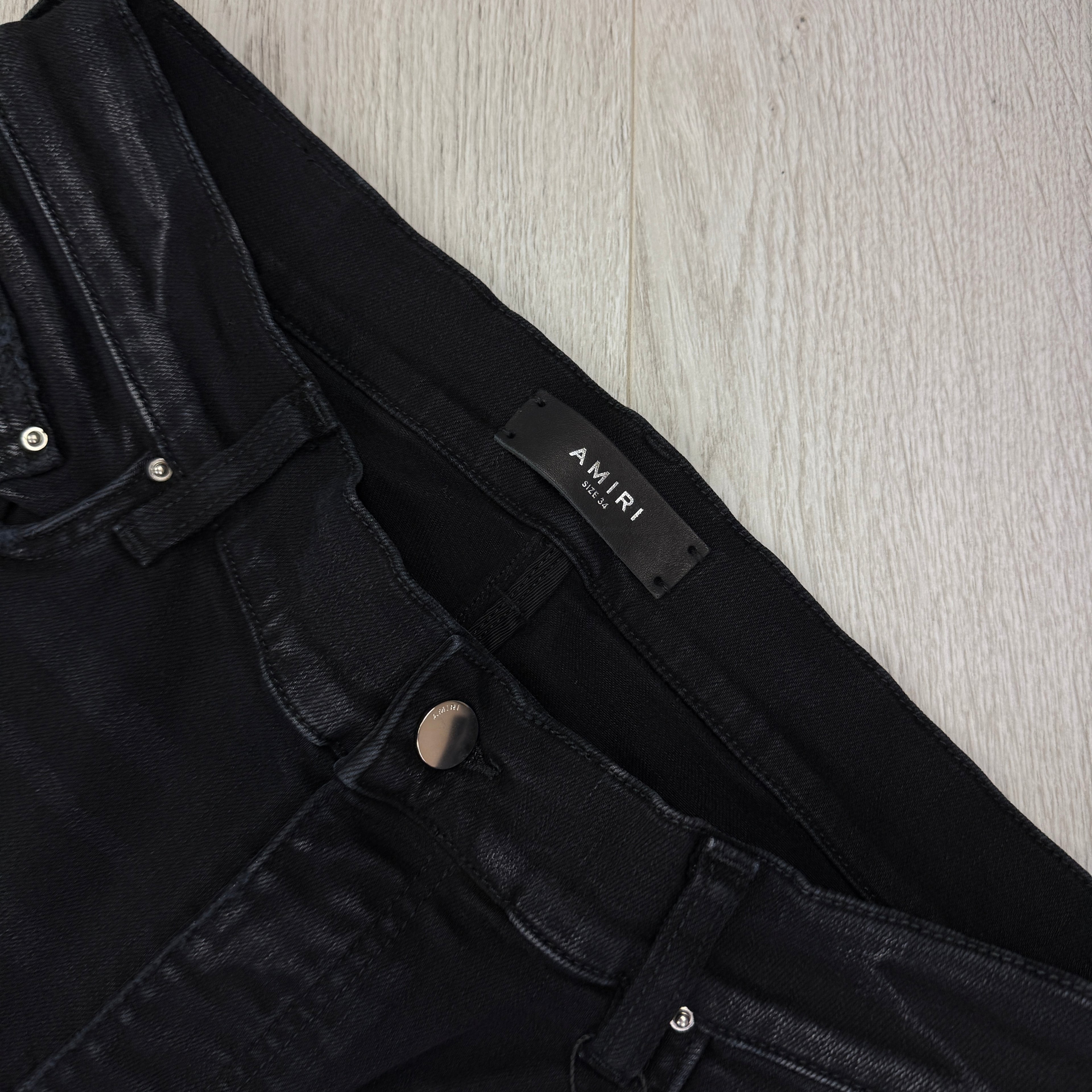 Amiri MX1 Men’s Black Distressed Core Camouflage Applique Jeans