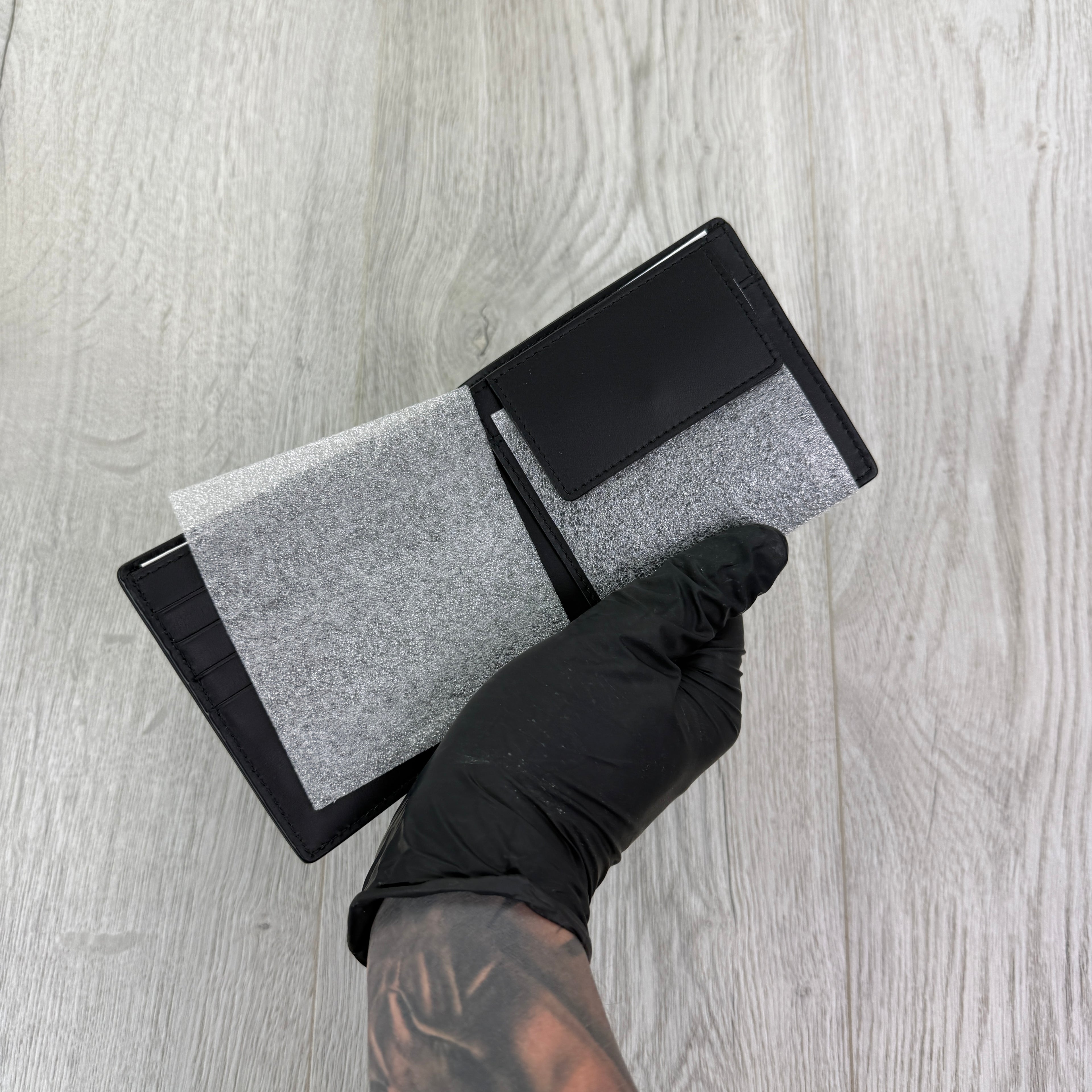 Burberry Men’s Black Leather Bifold Wallet Silver Logo