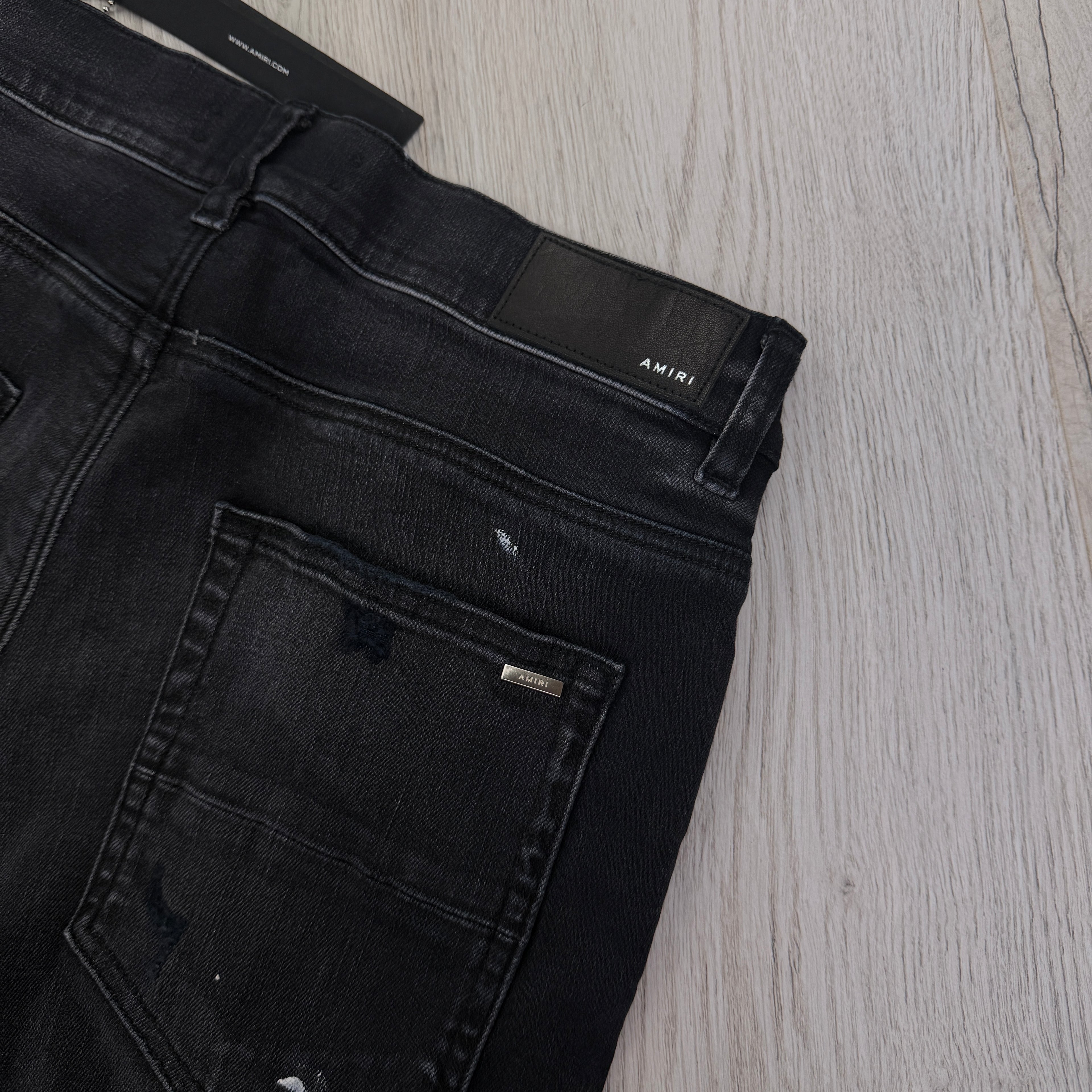 Amiri Men’s MX1 MA Logo Drip Black Distressed Jeans